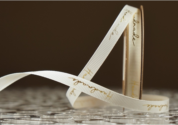 Стрічка репсова з написом "Hand Made" (0,9 см *23 м), молочний (№02m) (1рулон) Стрічка репсова з написом "Hand Made" (0,9 см *23 м), молочний (№02m) (1рулон)