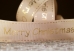 Репсова новорічна стрічка "Merry Christmas" коричневий (4,0 см *23 м) (1рулон)